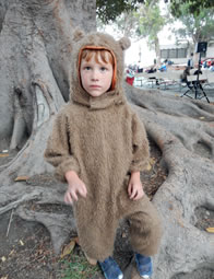 Photo of Crockett in bear suit by big tree