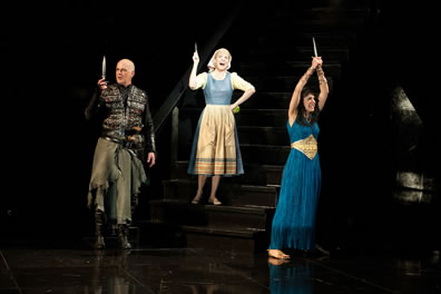 The three leads hold up daggers (paring knife for Cinderella)