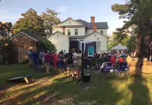 Photo of theater and crowd in Poe House backyard
